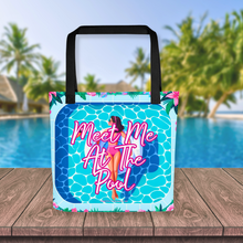 Load image into Gallery viewer, Bright and playful 'Meet Me At The Pool' tote bag featuring an illustration of a woman on a swan floatie in a pool, complete with a bold, inviting logo, set against a vibrant poolside scene for a perfect summer accessory.