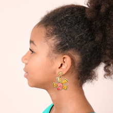 Load image into Gallery viewer, A kid with her head turned wearing a Rugrats Cynthia earring