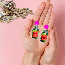 Load image into Gallery viewer, A hand holding douchebag jar earrings from new girl