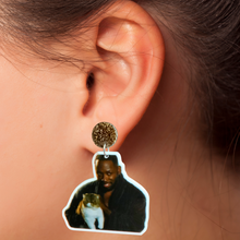 Load image into Gallery viewer, A close up of an ear wearing an earring featuring Winston from New Girl in his robe holding Ferguson the cat