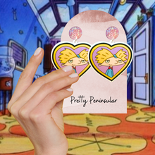 Load image into Gallery viewer, Helga’s Secret Love’ Locket Earrings – Featuring Arnold from Hey Arnold!, these nostalgic earrings capture the essence of young love and cartoon crushes