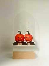 Load image into Gallery viewer,  Earrings featuring Dwight Schrute from “The Office” with a pumpkin stuck on his head, symbolizing his love for practical jokes and farm-related humor during the spooky season.
