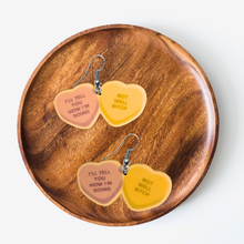 Load image into Gallery viewer, A jewelry tray featuring earrings with Dorinda Medley's quote from Real Housewives of New York: "I'll Tell You How I'm Doing" on one heart and "Not Well Bitch" on the other.
