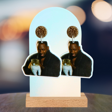Load image into Gallery viewer, Earrings featuring Winston from New Girl in his robe holding Ferguson the cat