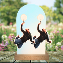 Load image into Gallery viewer, Earrings on a garden table featuring Nick Miller jumping up in the air, from his infamous “Freeze Frame” New Girl moment