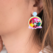 Load image into Gallery viewer, Up close image of an ear with a Golden Girls earring