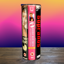 Load image into Gallery viewer, A 20 oz stainless steel insulated tumbler featuring a vinyl wrap of VHS covers from iconic '90s TV shows, including Friends, The Sopranos, The Fresh Prince of Bel-Air, and Sex and the City. Comes with a lid and reusable straw, perfect for nostalgic TV lovers.
