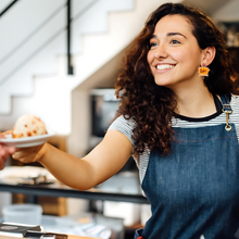Load image into Gallery viewer, A barista wearing “Luke’s Diner” earrings