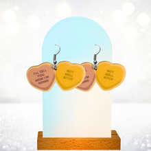 Load image into Gallery viewer, Earrings featuring Dorinda Medley's quote from Real Housewives of New York: "I'll Tell You How I'm Doing" on one heart and "Not Well Bitch" on the other.