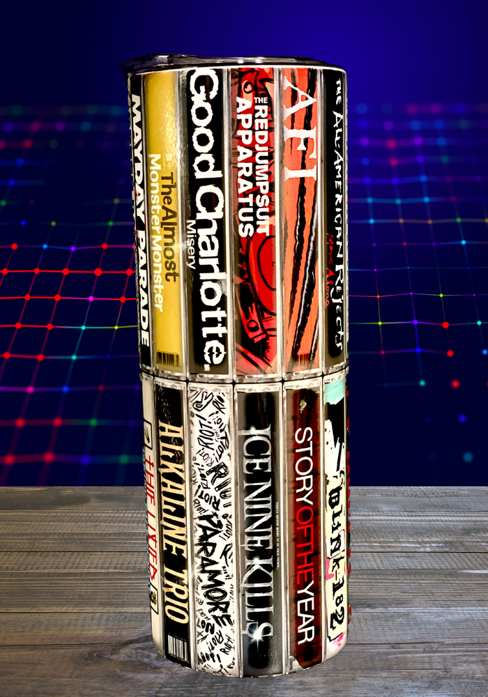 A 20 oz stainless steel insulated tumbler featuring sublimated cassette designs with band names from the Elder Emo era, including Paramore, Fall Out Boy, My Chemical Romance, Blink-182, and The All-American Rejects. Comes with a secure lid and reusable straw, perfect for hot and cold drinks.