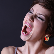 Load image into Gallery viewer, An angry girl wearing earrings featuring Dad from 'Fairly Oddparents' yelling 'DINKLEBERG'