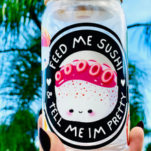 Load image into Gallery viewer, Feed Me Sushi and Tell Me I'm Pretty 16 oz glass cup with bamboo lid and reusable glass straw, featuring a sushi-themed design with colorful rolls, soy sauce, and chopsticks.