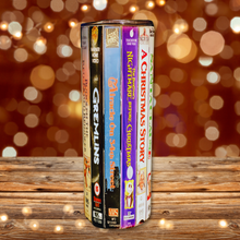 Load image into Gallery viewer, A 20 oz stainless steel insulated Christmas Movie Tumbler featuring a colorful design with movie covers including Gremlins, Miracle on 34th Street, Nightmare Before Christmas, and a Christmas Story. Comes with a clear lid, metal straw, and straw cleaner, perfect for hot and cold drinks.