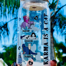 Load image into Gallery viewer, A 20 oz glass cup featuring colorful cat illustrations and Taylor Swift album-inspired designs, with the phrase "Karma is a Cat," paired with a bamboo lid and glass straw. Perfect for Swifties and cold drink lovers.