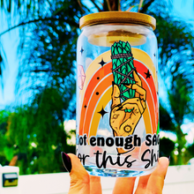 Load image into Gallery viewer, A 16oz BPA-free glass cup with a UVDTF wrap featuring a retro rainbow, celestial accents, and a smudge stick design. Includes a bamboo lid and reusable glass straw, perfect for iced drinks.
