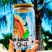 Load image into Gallery viewer, A 16oz BPA-free glass cup with a UVDTF wrap featuring a retro rainbow, celestial accents, and a smudge stick design. Includes a bamboo lid and reusable glass straw, perfect for iced drinks.
