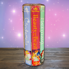 Load image into Gallery viewer, A 20 oz stainless steel insulated tumbler featuring a vibrant design with vintage Disney princess VHS covers, including Cinderella, Beauty and the Beast, and The Little Mermaid. Comes with a clear lid, metal straw, and straw cleaner, perfect for hot and cold drinks.