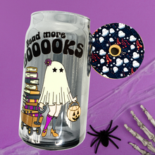Load image into Gallery viewer, A 16 oz glass cup featuring a cute ghost design pulling a wagon full of books with the text "Read More BOOks." Includes a bamboo lid decorated with tiny ghosts and a reusable glass straw, ideal for book lovers.