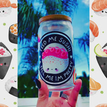 Load and play video in Gallery viewer, Feed Me Sushi and Tell Me I'm Pretty 16 oz glass cup with bamboo lid and reusable glass straw, featuring a sushi-themed design with colorful rolls, soy sauce, and chopsticks.