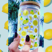 Load and play video in Gallery viewer, 16 oz BPA-free glass cup with a vibrant lemon design and cheeky quote: 'When life gives you lemons, make lemonade, don’t be a sour bitch.' Includes a bamboo lid and reusable glass straw.