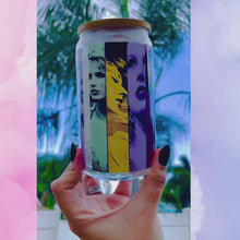 Load and play video in Gallery viewer, A 16oz BPA-free glass cup with a UVDTF wrap featuring Taylor Swift's iconic eras, complete with a bamboo lid and reusable glass straw. Perfect for Swifties and cold drinks.