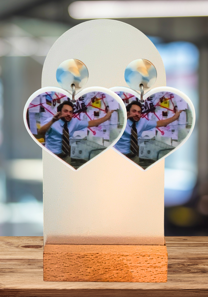 An office background with Always Sunny earrings featuring Charlie Kelly talking about his Pepe Silva conspiracy