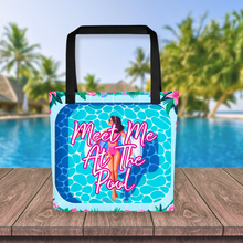 Load image into Gallery viewer, Bright and playful &#39;Meet Me At The Pool&#39; tote bag featuring an illustration of a woman on a swan floatie in a pool, complete with a bold, inviting logo, set against a vibrant poolside scene for a perfect summer accessory.
