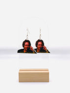 Earrings featuring the iconic smirk of Robert California from 'The Office', emblazoned with his audacious claim: 'I'm the f*cking lizard king.' 