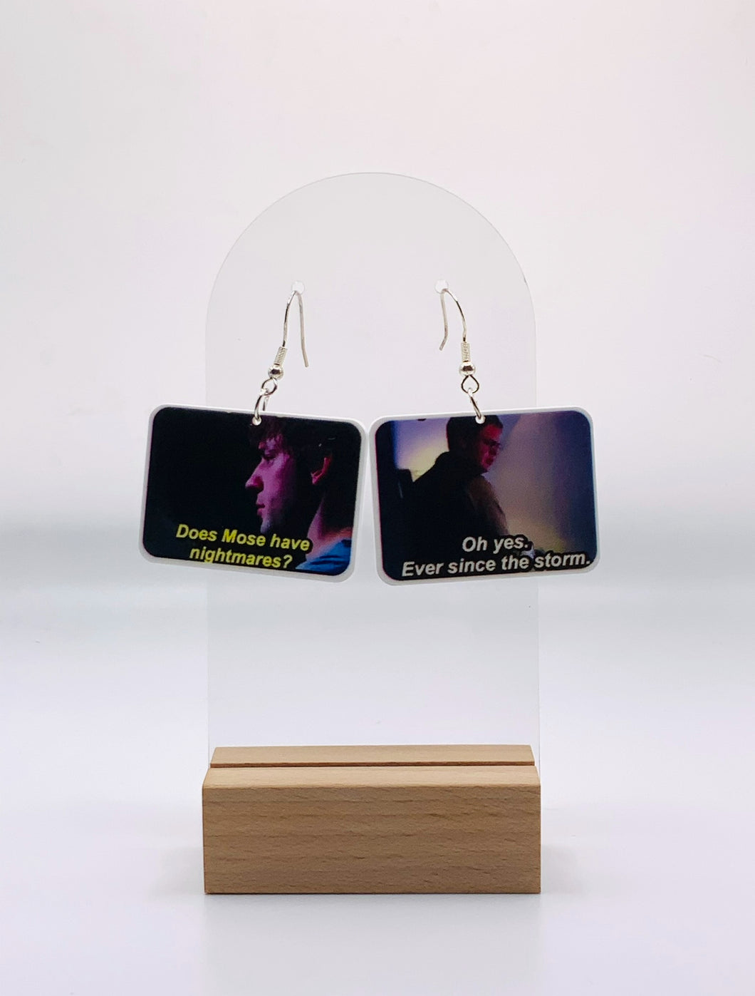 Earrings immortalizing the intriguing exchange between Jim and Dwight about Mose's sleep patterns, set against the backdrop of Schrute Farms. These pieces capture the moment with 'Does Mose have nightmares?' and Dwight's somber 'Oh yes, ever since the storm,' 