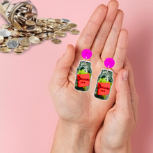 Load image into Gallery viewer, A hand holding douchebag jar earrings from new girl
