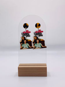 Handcrafted acrylic earrings showcasing the iconic '10 Things I Hate About You' movie poster design. The earrings feature a vibrant image featuring Julia Stiles leaning against Heath Ledger. The bold typography says "10 things I hate about you", with 10 things highlighted in pink