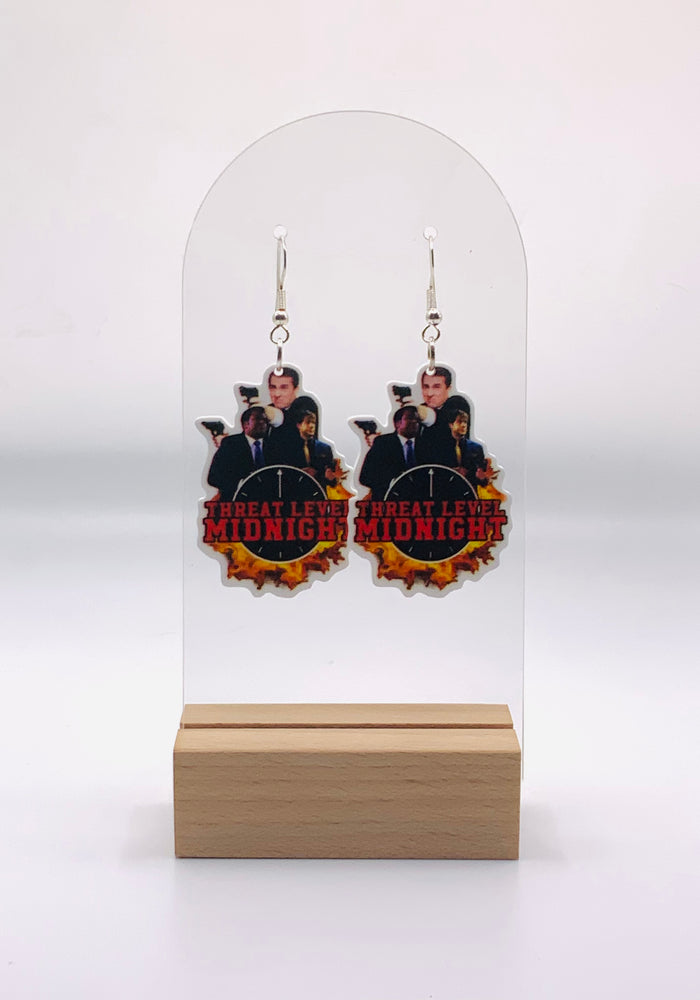 Earrings featuring intricately detailed miniatures from 'The Office's' 'Threat Level Midnight'. Each piece captures the unforgettable characters of Michael Scott’s film, from Scarn's heroic gaze to Goldenface's mischievous smirk and the President's commanding presence