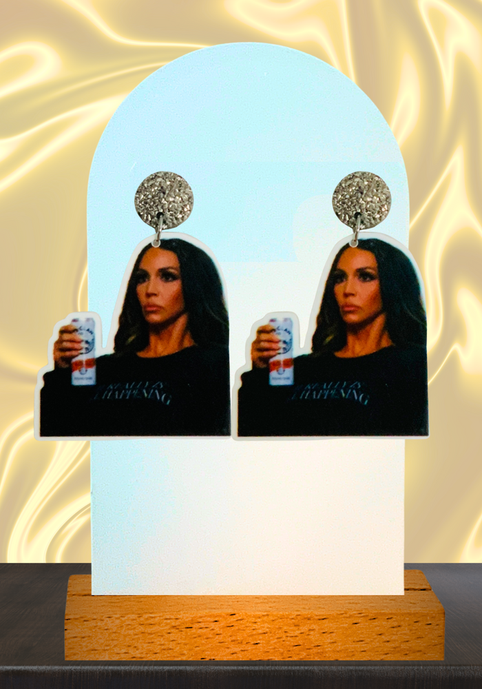 Earrings featuring Scheana Shay drinking a beverage in shock from Raquel’s reunion bombshell on Vanderpump Rules.