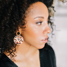 Load image into Gallery viewer, A woman turned to the side, showcasing her “One Tree Hill” earring on her ear
