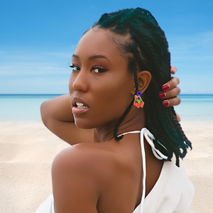 A model on the beach looking back and wearing a dangling Patrick Star earring