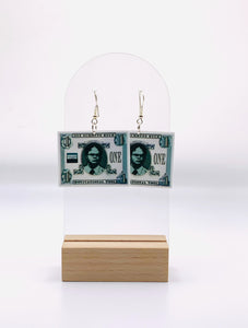 arrings shaped like Schrute Bucks, featuring the iconic beet motif and Dwight’s signature, representing the quirky currency from “The Office” for a touch of humor and motivation.