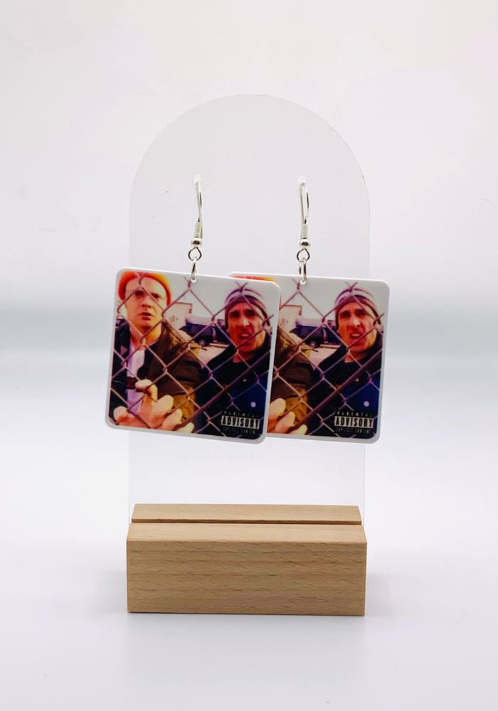 Earrings showcasing Michael Scott and Dwight as would-be rappers on the mock album cover “Straight Outta Scranton,” complete with a humorous ‘Parental Advisory’ label.