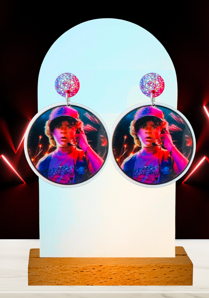 A red neon background with earrings featuring Dustin from Stranger Things
