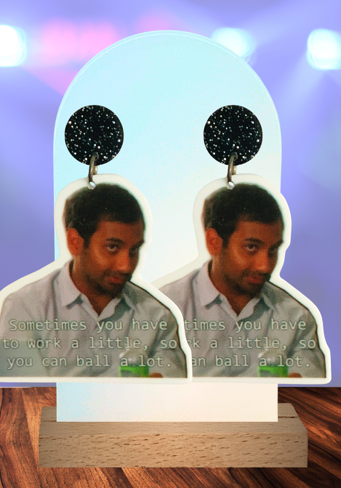 Earrings featuring Tom Haverford’s iconic quote from Parks and Rec, embodying the hustle and luxury of Pawnee’s most stylish entrepreneur.