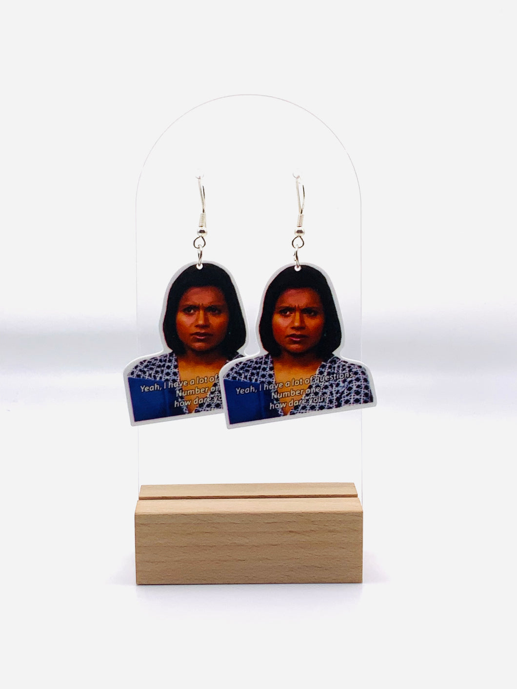 Earrings inspired by Kelly Kapoor from 'The Office', showcasing her unforgettable moment of outrage with the caption 'Yeah. I have a lot of questions. Number one, how dare you?'