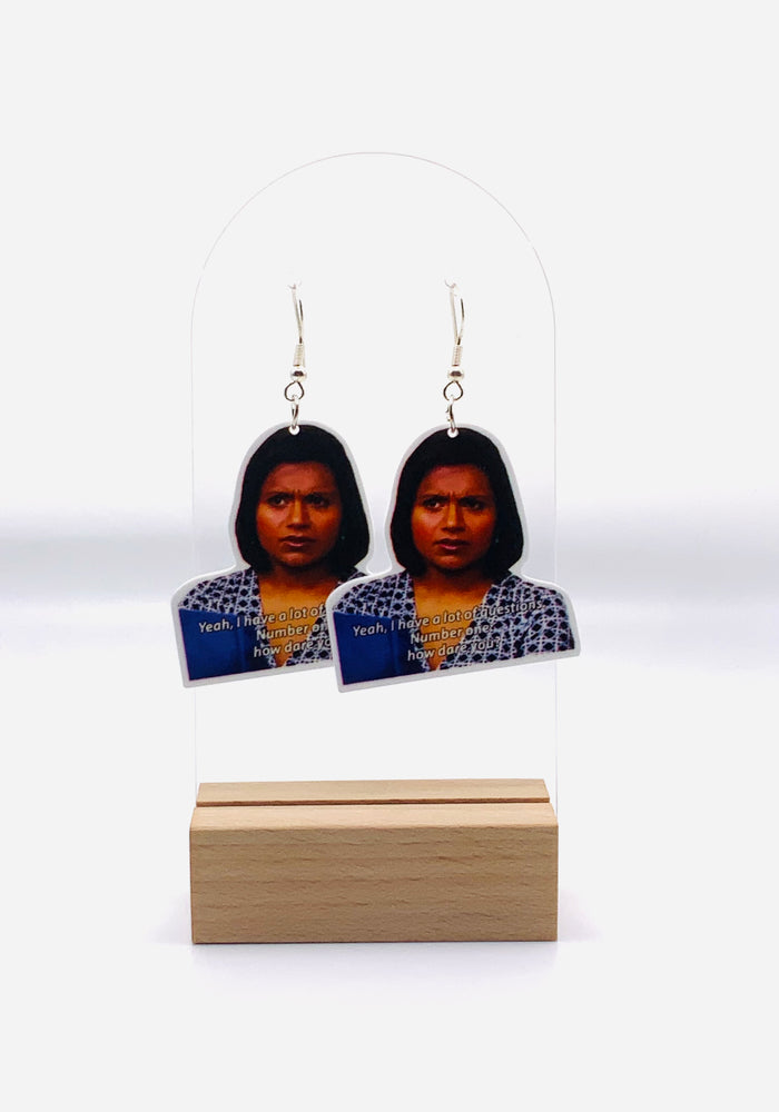 Earrings inspired by Kelly Kapoor from 'The Office', showcasing her unforgettable moment of outrage with the caption 'Yeah. I have a lot of questions. Number one, how dare you?'