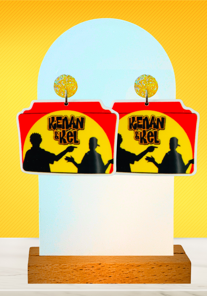 Kenan and Kel earrings on a yellow background