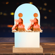 A bar featuring Vanderpump Rules earrings featuring Kristen Doute chugging a glass of wine with the caption 'Crazy Kristen,' for fans who love the show's bold fun.