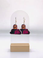  Earrings featuring the humorous quote 'It's Britney, Bitch', a nod to Michael Scott's pop culture mix-up from 'The Office'. Designed for fans of the show, Britney Spears, and Lady Gaga, these earrings make a bold fashion statement that reflects a love for television comedy and pop diva moments.