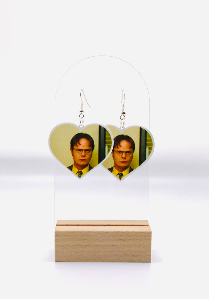 Heart-shaped earrings featuring the iconic, no-nonsense stare of Dwight Schrute from The Office