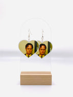 Heart-shaped earrings featuring the iconic, no-nonsense stare of Dwight Schrute from The Office