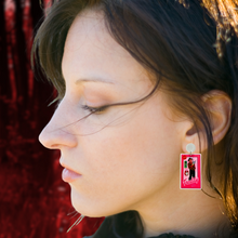 Load image into Gallery viewer, Earrings featuring Freddy Krueger in a Barbie-style box, with an Elm Street sign and alarm clock, ideal for fans of horror movies and playful Halloween fashion.
