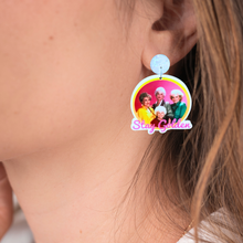 Load image into Gallery viewer, Up close image of an ear with a Golden Girls earring
