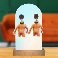 Earrings featuring a photo of cheeky Frank Reynolds walking away pant less in front of a couch background