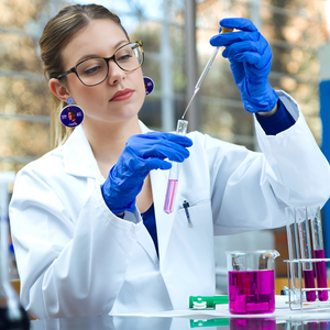 A female scientist wearing Bill Nye the Science Guy earrings